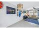 Spacious living room with comfortable seating, modern decor, and a view of backyard pool at 6902 El Centro Ct, Tampa, FL 33634