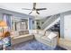 Inviting living room with plush rug, comfortable sofa, and access to the backyard at 6902 El Centro Ct, Tampa, FL 33634