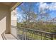 A condo balcony featuring a beautiful view of lush foliage and distant water views at 732 Coral Reef Dr # 732, Tampa, FL 33602