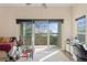 Bedroom offers great natural light, a balcony with a scenic view, and a ceiling fan at 732 Coral Reef Dr # 732, Tampa, FL 33602