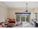Spacious bedroom featuring track lighting, ceiling fan, and balcony access with scenic views at 732 Coral Reef Dr # 732, Tampa, FL 33602