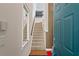 Bright entryway with a staircase, a light fixture, and an open door at 732 Coral Reef Dr # 732, Tampa, FL 33602