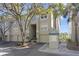Condo's exterior featuring an attached garage, mailbox, and view of beautiful palm trees at 732 Coral Reef Dr # 732, Tampa, FL 33602