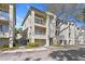Exterior of a multi-story townhouse with balconies, landscaping, and modern architectural details at 732 Coral Reef Dr # 732, Tampa, FL 33602