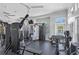Well-equipped fitness center with modern weight machines and ample natural light, set against a neutral color palette at 732 Coral Reef Dr # 732, Tampa, FL 33602