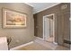 Inviting hallway with neutral tones and a decorative painting, leading to a closet and other rooms at 732 Coral Reef Dr # 732, Tampa, FL 33602