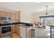 A full kitchen open to the living space and balcony with lots of natural light at 732 Coral Reef Dr # 732, Tampa, FL 33602
