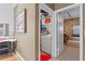 Laundry room with white washer and dryer, shelving, and easy access to an adjacent room at 732 Coral Reef Dr # 732, Tampa, FL 33602