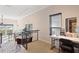 Carpeted open living area with adjacent dining space and large window views at 732 Coral Reef Dr # 732, Tampa, FL 33602