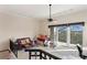 Spacious living room with ceiling fan, track lighting, and beautiful balcony views at 732 Coral Reef Dr # 732, Tampa, FL 33602