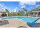 Inviting swimming pool offers a relaxing atmosphere with lounge chairs and city views against a bright blue sky at 732 Coral Reef Dr # 732, Tampa, FL 33602