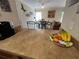 Kitchen counter that overlooks the dining area and a glimpse of the living room at 755 Haven Pl, Tarpon Springs, FL 34689