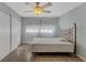 Bedroom boasts wood floors, large closet, natural light and a ceiling fan above for comfort and convenience at 8457 Deauville # 8457, Pinellas Park, FL 33781