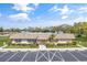 The community clubhouse has ample parking, lush landscaping and a well manicured lawn at 8457 Deauville # 8457, Pinellas Park, FL 33781