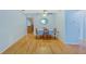 Open dining room area with wood floors and neutral wall colors at 8457 Deauville # 8457, Pinellas Park, FL 33781