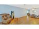 Open-concept living space with hardwood floors and dining area at 8457 Deauville # 8457, Pinellas Park, FL 33781