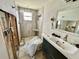 Renovated bathroom featuring modern fixtures, a tiled shower, and a stylish vanity, needs repair at 8537 Horizon Ln, Hudson, FL 34667