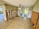 Open dining room featuring tile floors and neutral paint offers a comfortable space for entertaining at 8537 Horizon Ln, Hudson, FL 34667