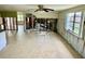 Open-concept space with tile floors, exposed framing, bright lighting, and views into other rooms at 8537 Horizon Ln, Hudson, FL 34667