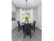 Cozy dining area with stylish light fixture, seating for four, with natural light and decor at 901 Eagle Ln, Apollo Beach, FL 33572