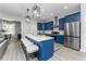 Beautiful kitchen with a large island, stainless steel appliances, and barstool seating at 901 Eagle Ln, Apollo Beach, FL 33572