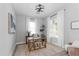 Bright home office featuring natural light, neutral tones, and a stylish desk setup at 901 Eagle Ln, Apollo Beach, FL 33572