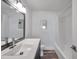 Bright bathroom featuring a modern sink, framed mirror, and combined shower-tub at 921 7Th Nw St, Largo, FL 33770