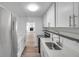 Bright kitchen featuring white cabinets, granite countertops, stainless steel appliances at 921 7Th Nw St, Largo, FL 33770