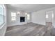 Bright living room featuring a fireplace, modern flooring, and lots of natural light at 921 7Th Nw St, Largo, FL 33770