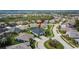 Aerial view of a lovely home with a manicured lawn, mature landscaping, and a circular driveway at 6927 Crestpoint Dr, Apollo Beach, FL 33572