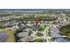 Beautiful aerial view of a home in a well-planned community surrounded by lush landscaping and ponds at 6927 Crestpoint Dr, Apollo Beach, FL 33572