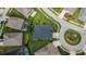 Aerial view of home with manicured lawn, lush landscaping, pool and circular driveway at 6927 Crestpoint Dr, Apollo Beach, FL 33572