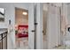 Open bathroom with shower-tub and bedroom view at 6927 Crestpoint Dr, Apollo Beach, FL 33572