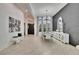 Elegant dining area featuring modern chandelier, mirrored table and accent furniture and decor at 6927 Crestpoint Dr, Apollo Beach, FL 33572