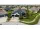 Beautiful house with three-car garage and well-manicured lawn in a quiet neighborhood at 6927 Crestpoint Dr, Apollo Beach, FL 33572