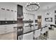 Modern kitchen features a large island with seating, a stylish backsplash, and high-end appliances at 6927 Crestpoint Dr, Apollo Beach, FL 33572