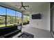 Open screened-in lanai with outdoor seating, dining area, and view of lush greenery at 6927 Crestpoint Dr, Apollo Beach, FL 33572