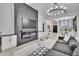 Bright and modern living room featuring a unique fireplace, and stylish decor at 6927 Crestpoint Dr, Apollo Beach, FL 33572