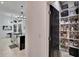 Pantry with organized shelves, ideal for storage, adjacent to the kitchen and dining area at 6927 Crestpoint Dr, Apollo Beach, FL 33572