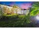 Backyard at dusk featuring a screened patio and lush landscaping at 6927 Crestpoint Dr, Apollo Beach, FL 33572