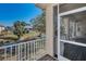 Scenic backyard view from the porch, featuring a waterway and well-maintained landscaping at 1010 Blue Heron Way, Tarpon Springs, FL 34689