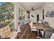Relax on the screened patio overlooking tranquil water, creating an inviting outdoor living space at 1010 Blue Heron Way, Tarpon Springs, FL 34689