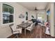 Inviting screened porch with comfortable seating and a peaceful outdoor dining space at 1010 Blue Heron Way, Tarpon Springs, FL 34689