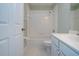 Bathroom featuring a shower-tub combo with white tile and neutral flooring at 1020 New Winsor Loop # 46, Sun City Center, FL 33573