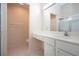 Bathroom with glass shower, updated vanity and fixtures, and tile flooring at 1020 New Winsor Loop # 46, Sun City Center, FL 33573