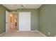 Bedroom with a double door closet and an open doorway to the attached bathroom at 1020 New Winsor Loop # 46, Sun City Center, FL 33573