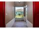 View from entrance showcasing tiled flooring and a glimpse of the outdoor landscape of lush greenery under a clear sky at 1020 New Winsor Loop # 46, Sun City Center, FL 33573