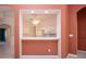 Stylish kitchen with breakfast bar and white cabinetry in an open-concept space with terra cotta colored walls at 1020 New Winsor Loop # 46, Sun City Center, FL 33573