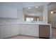 This kitchen has bright, clean, white cabinetry and lots of storage space at 1020 New Winsor Loop # 46, Sun City Center, FL 33573