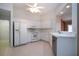 Well-equipped kitchen boasting white cabinetry, modern appliances, and ample counter space at 1020 New Winsor Loop # 46, Sun City Center, FL 33573